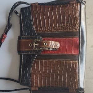 M.C. Handbag, genuine leather, light wear.